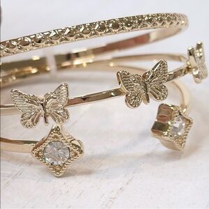 NWOT Gold Tone Butterfly Star Bangle Set